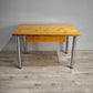 89283 Tavolo con base in alluminio e piano in legno