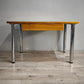 89283 Tavolo con base in alluminio e piano in legno