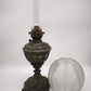 90362 Lampada ad olio con base in metallo lavorato