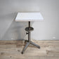 91809 Tavolino con base in ferro e piano in formica regolabile