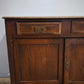 9188 Credenzina due sportelli in legno (da restaurare)