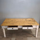 91977 Grande tavolo con base bianca e piano color legno