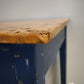 91978 Tavolo con base azzurra e piano color legno