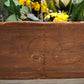 92239 Antica culla in legno con fiori sintetici
