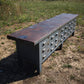 Bancone industriale vintage in legno con piano rivestito in ferro con 12 cassetti