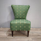 92588 Poltroncina imbottita e rivestita in tessuto verde