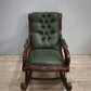 93052 Poltrona a dondolo con struttura in legno e rivestimento in simil pelle verde