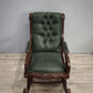 93052 Poltrona a dondolo con struttura in legno e rivestimento in simil pelle verde