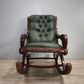 93052 Poltrona a dondolo con struttura in legno e rivestimento in simil pelle verde