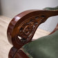 93052 Poltrona a dondolo con struttura in legno e rivestimento in simil pelle verde