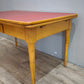 93258 Tavolo allungabile con piano in formica rossa
