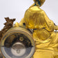 93221 Orologio con dama in metallo dorato e alzata in legno