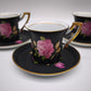 93826 Set n 4 tazzine con piattino in ceramica Limoges Sévrès nere con decorazione rose