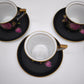 93826 Set n 4 tazzine con piattino in ceramica Limoges Sévrès nere con decorazione rose