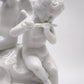 93872 Gruppo di puttini suonatori su uovo in ceramica bianca Ginori (Capodimonte)