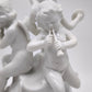 93872 Gruppo di puttini suonatori su uovo in ceramica bianca Ginori (Capodimonte)