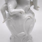 93872 Gruppo di puttini suonatori su uovo in ceramica bianca Ginori (Capodimonte)