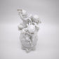 93872 Gruppo di puttini suonatori su uovo in ceramica bianca Ginori (Capodimonte)
