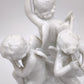 93872 Gruppo di puttini suonatori su uovo in ceramica bianca Ginori (Capodimonte)